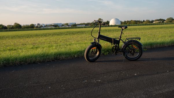 Black e-bike near green field