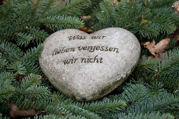 Heart-shaped stone with text